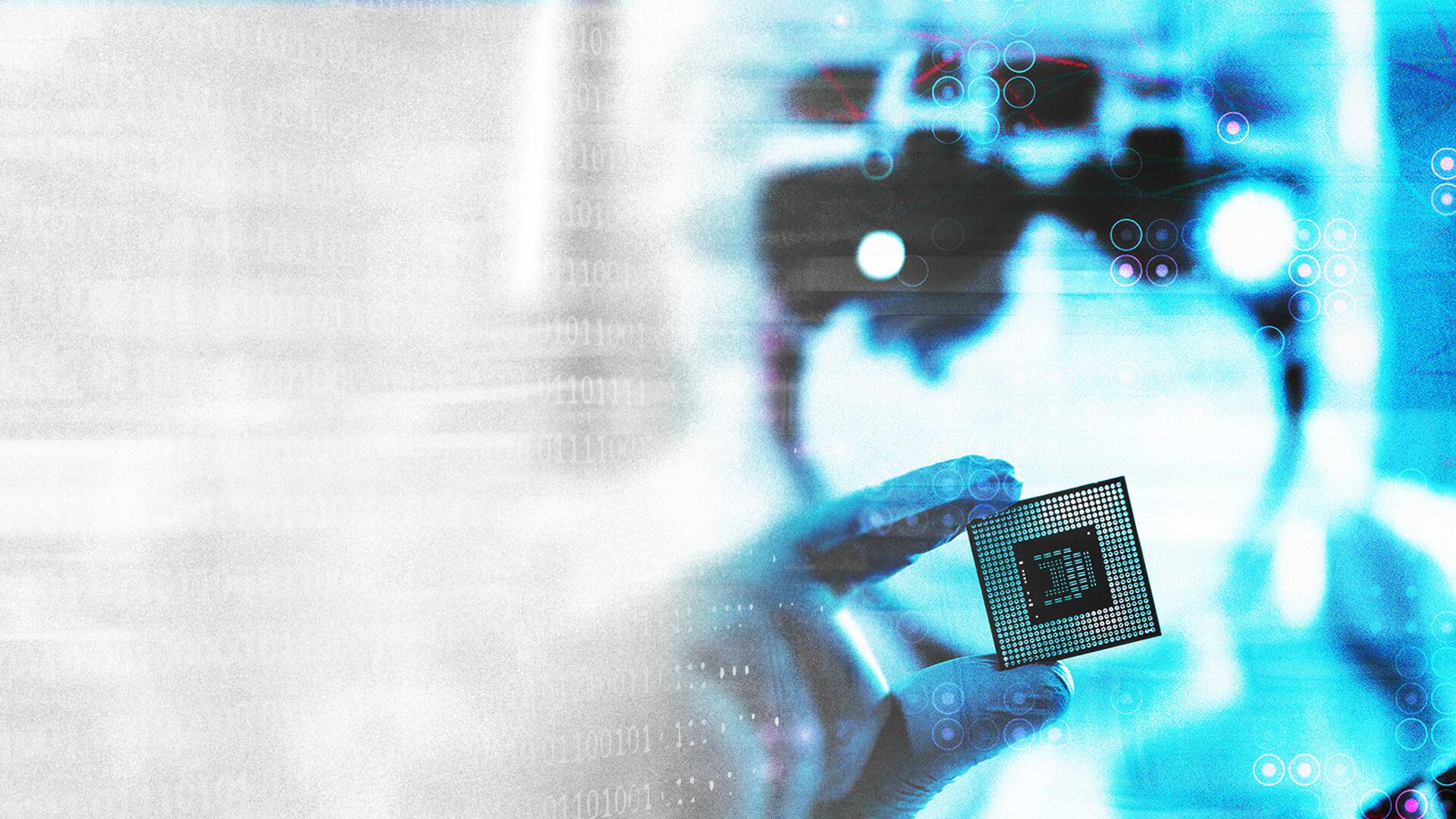 A person holds a microchip against a blurred, futuristic blue background with digital elements.